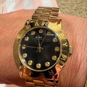 Gold Marc Jacob's watch. A few minor scratches on band and needs a new battery